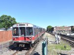 Southbound Braintree bound T Red Line Train of Bombardiar Cars arriving into Wollaston Station 